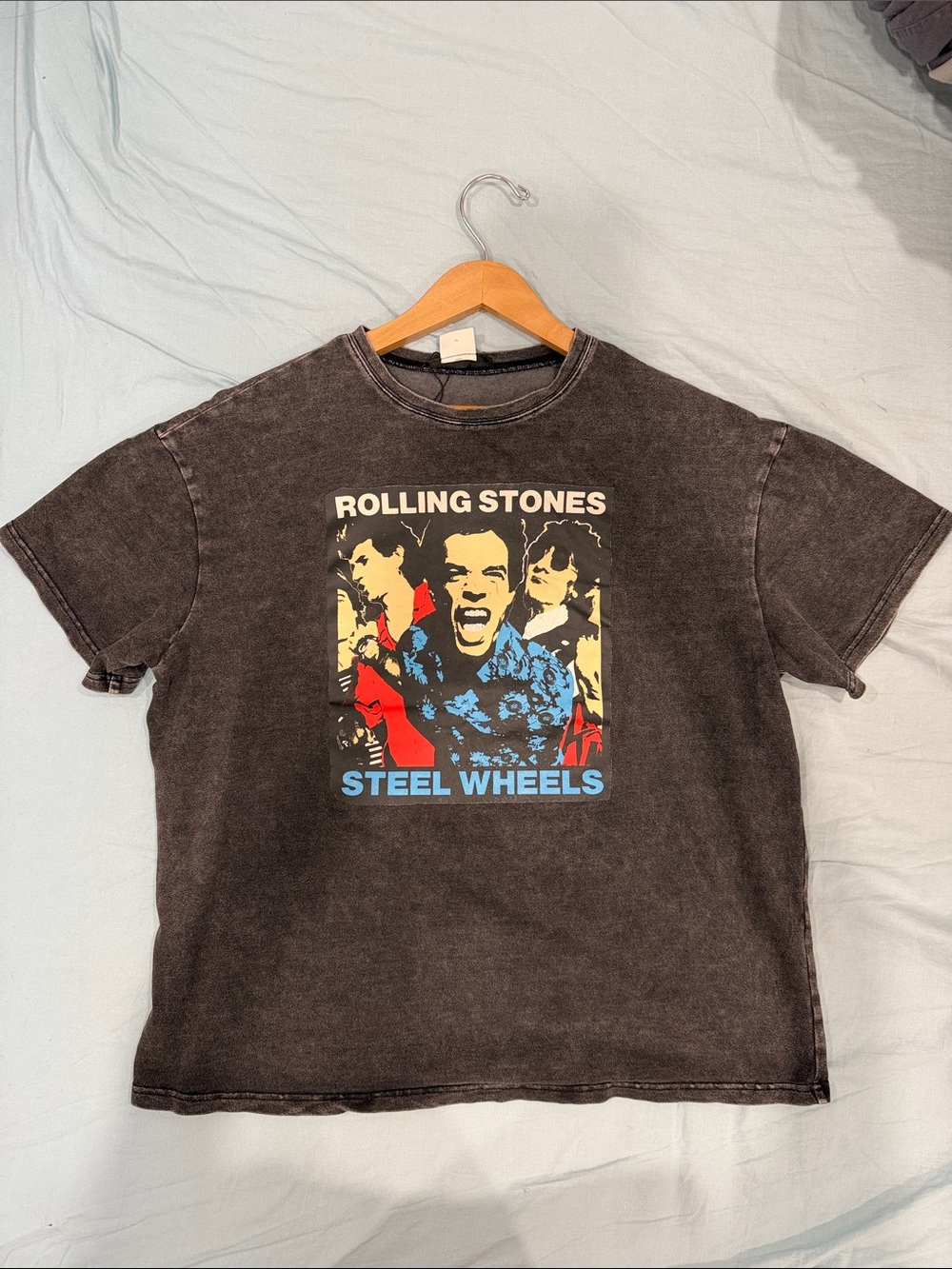 the Rolling Stones Black Steel Wheels Graphic Tee with Red & Blue Print